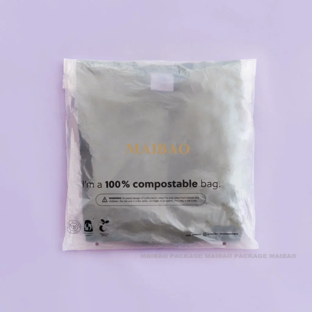 Перерабатываемые биоразлагаемые упаковочные пакеты для футболок для доставки на заказ с глянцевой поверхностью из пергамина для одежды, упаковочная сумка для футболок