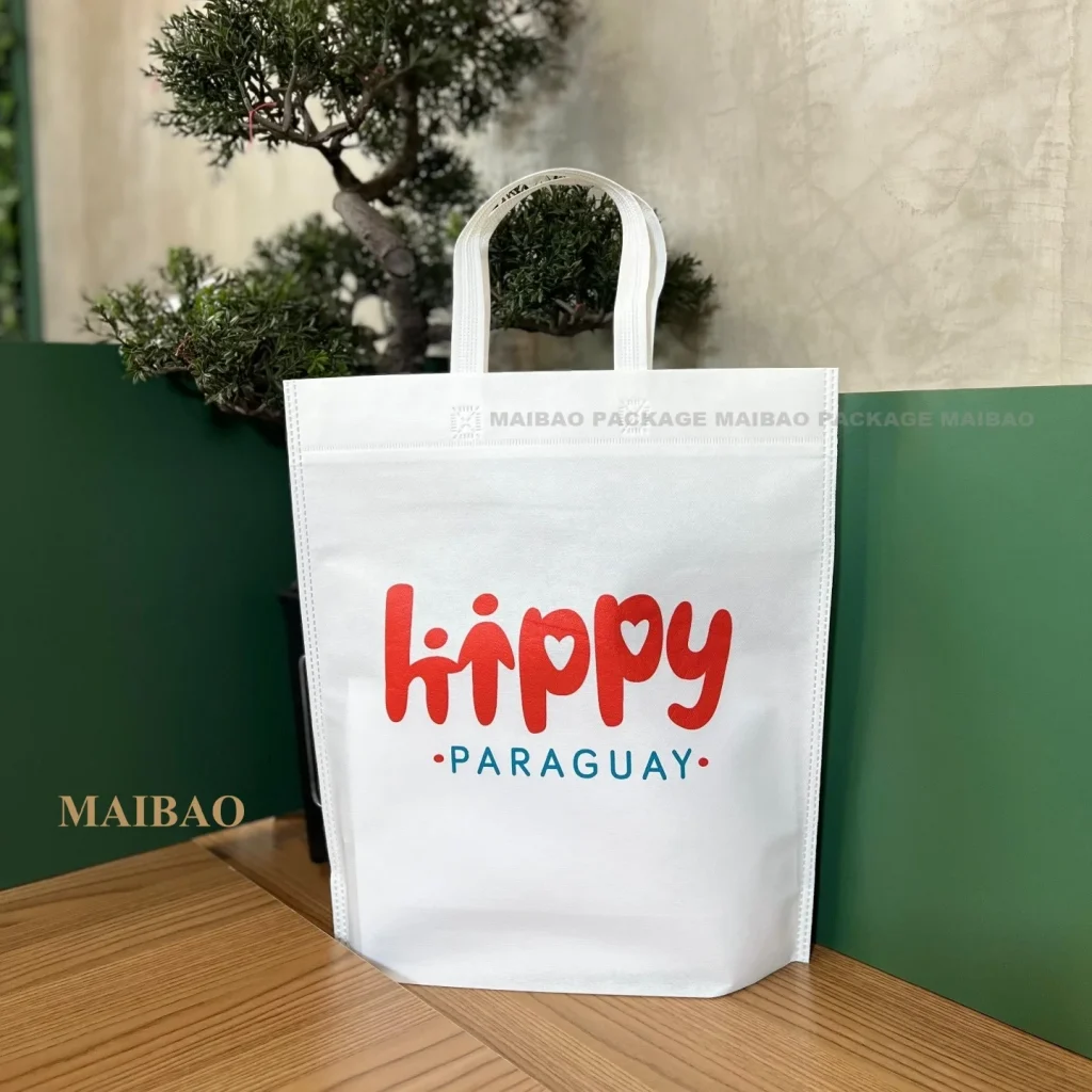 Изготовленная на заказ устойчивая экологически чистая многоразовая ткань для продуктов питания ультразвуковая складная складная нетканая сумка для покупок Rpet с кнопкой