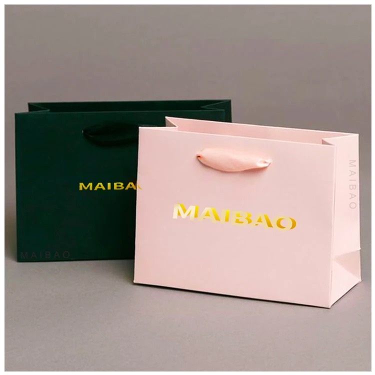 Оптовая продажа напечатанного на заказ логотипа Роскошный белый бумажный пакет Розничный бутик Подарочные бумажные пакеты с вашим собственным логотипом
